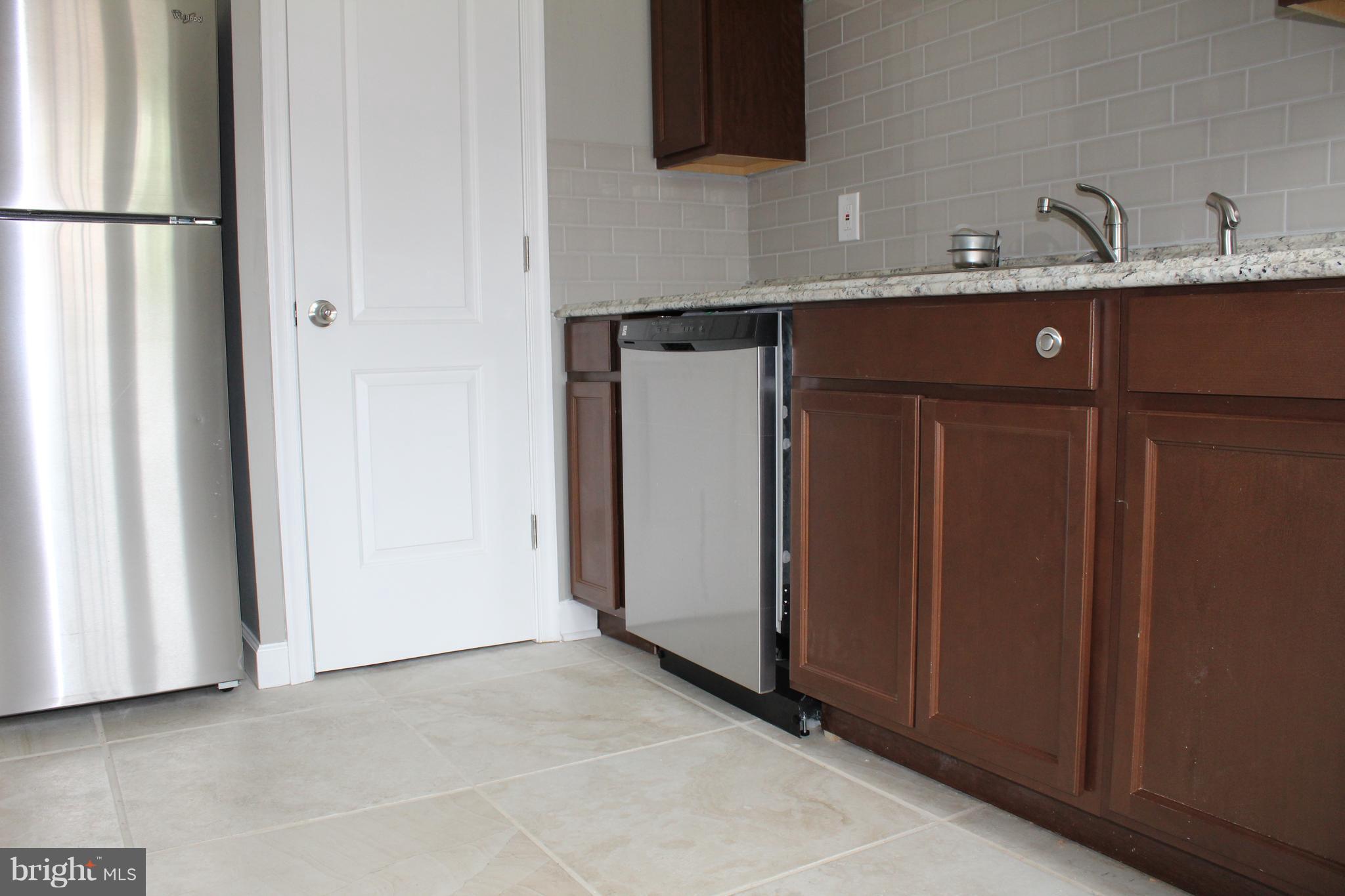 650 Queensgate Road Baltimore, MD 21229 - Photo 9 of 25 a view of storage and utility room with a sink