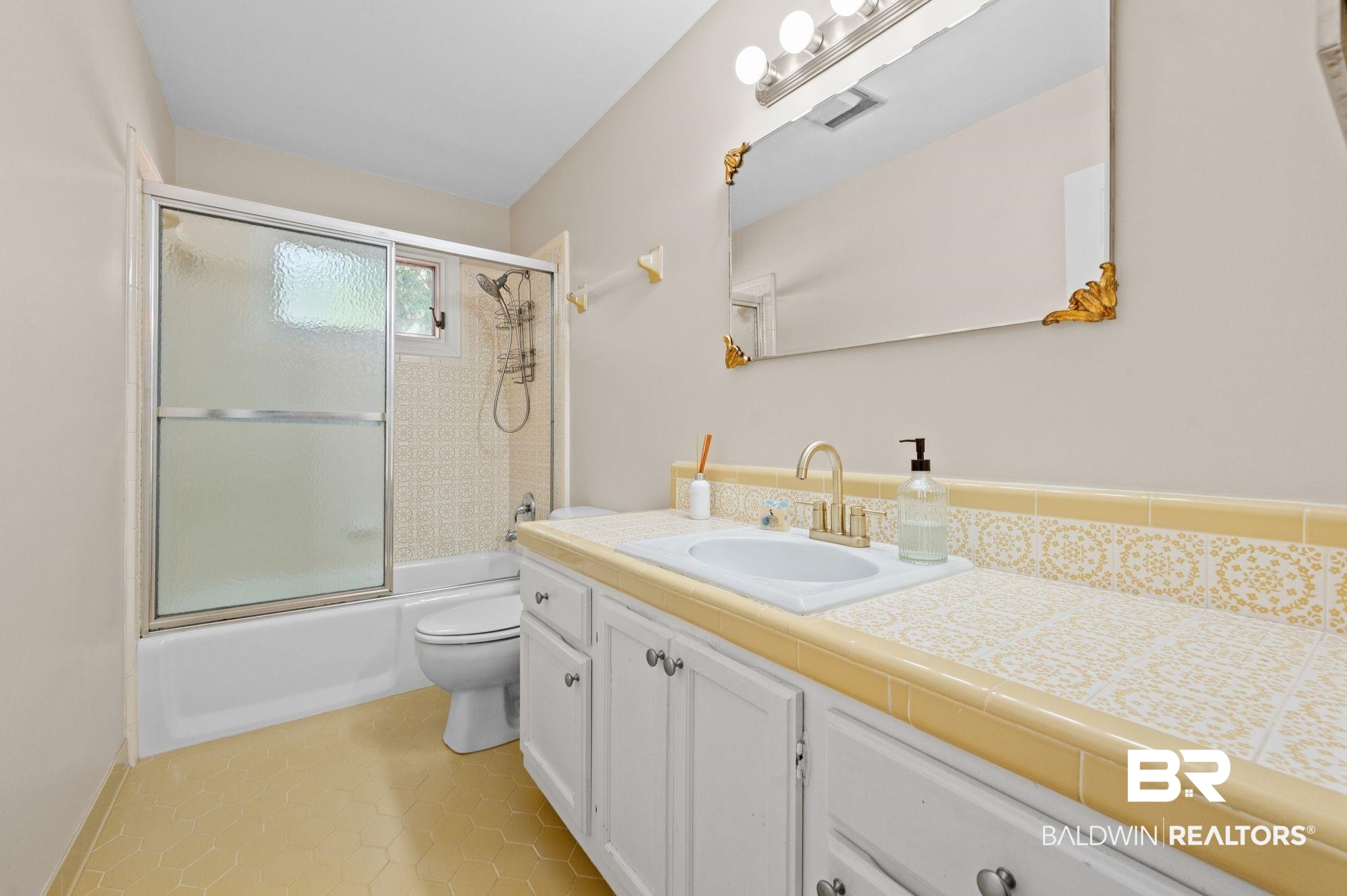 110 Ferncliff Circle Daphne, AL 36526 - Photo 29 of 40 Bathroom with toilet, vanity, shower / bath combination with glass door, and tile patterned floors