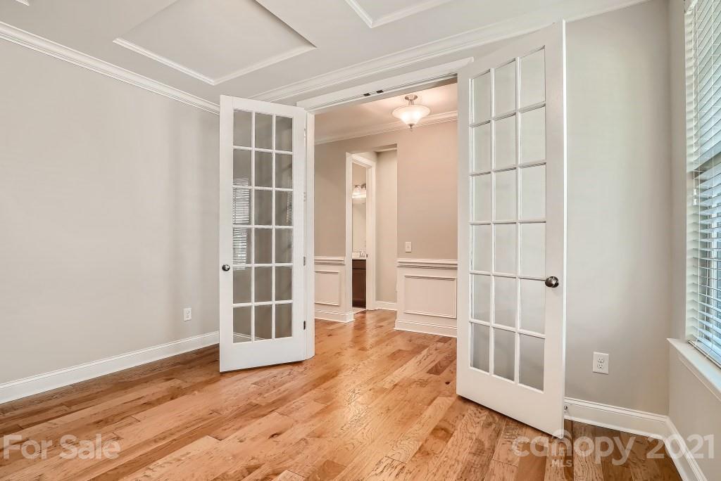 942 Emory Lane Fort Mill, SC 29708 - Photo 12 of 33 a view of an empty room with wooden floor and windows