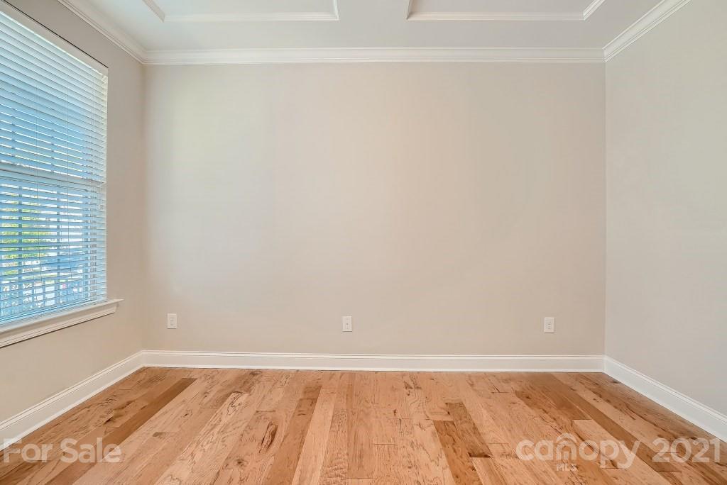 942 Emory Lane Fort Mill, SC 29708 - Photo 13 of 33 a view of an empty room with wooden floor and a window