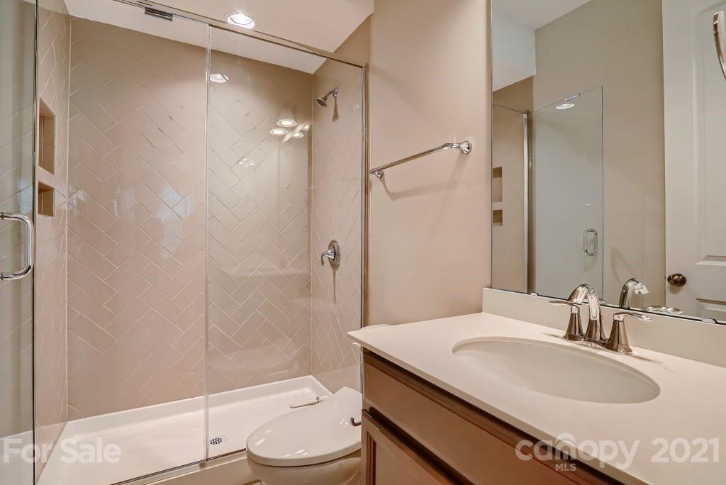 942 Emory Lane Fort Mill, SC 29708 - Photo 16 of 33 a bathroom with a granite countertop sink toilet and shower