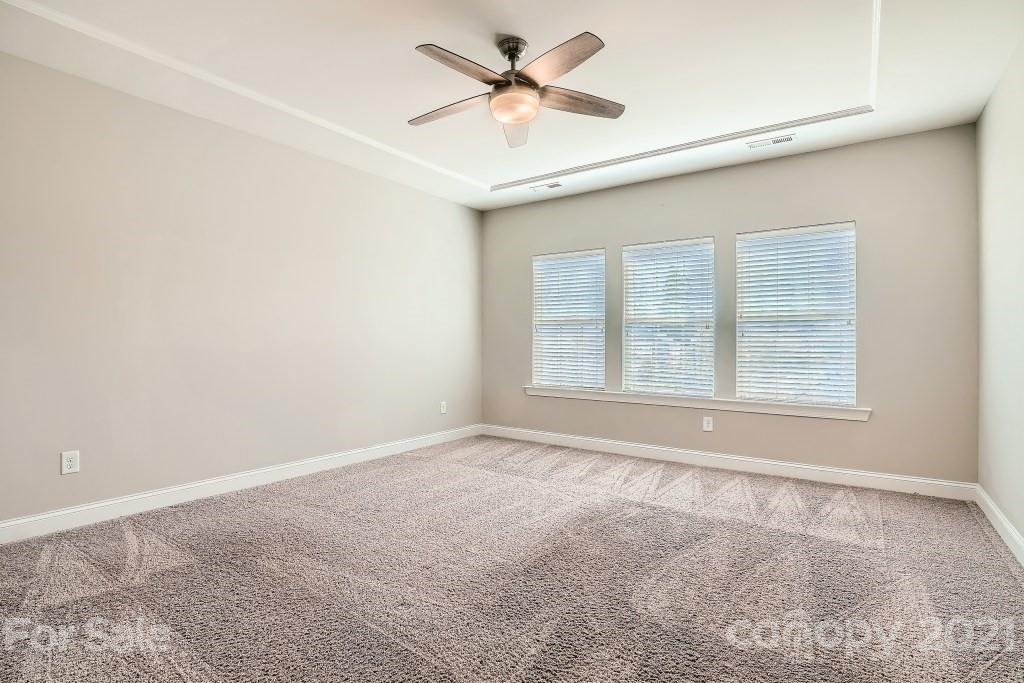 942 Emory Lane Fort Mill, SC 29708 - Photo 17 of 33 an empty room with a window and a fan