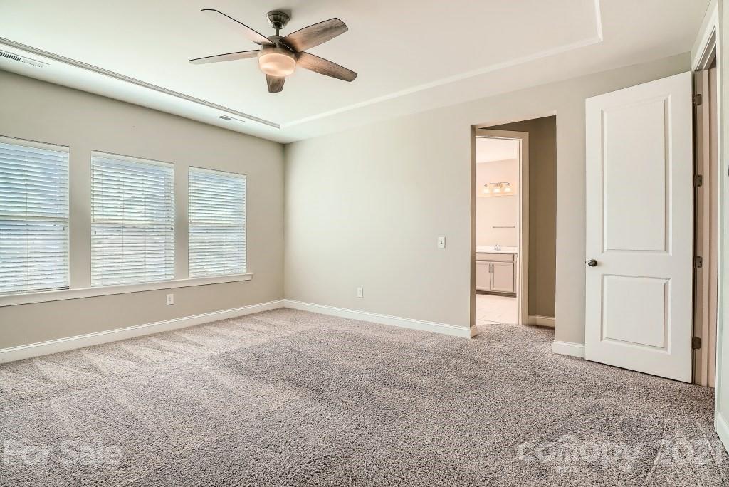 942 Emory Lane Fort Mill, SC 29708 - Photo 18 of 33 an empty room with windows and fan
