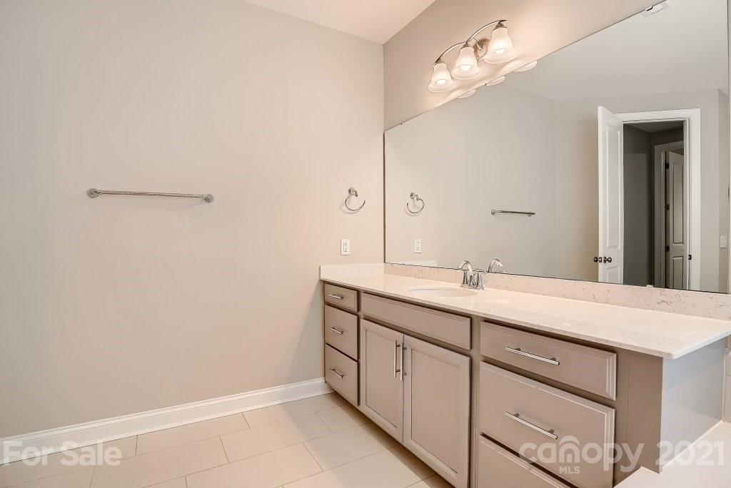 942 Emory Lane Fort Mill, SC 29708 - Photo 19 of 33 a bathroom with a sink a vanity and a mirror