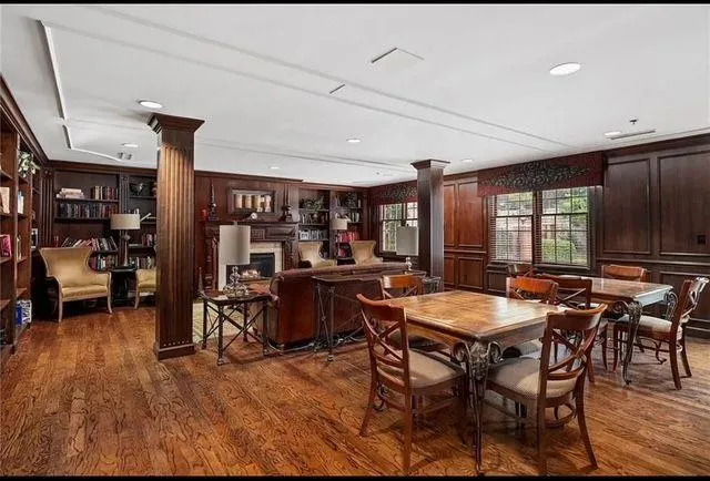 a view of a dining room with furniture window and wooden floor
