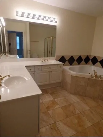 a bathroom with a sink a vanity and a mirror