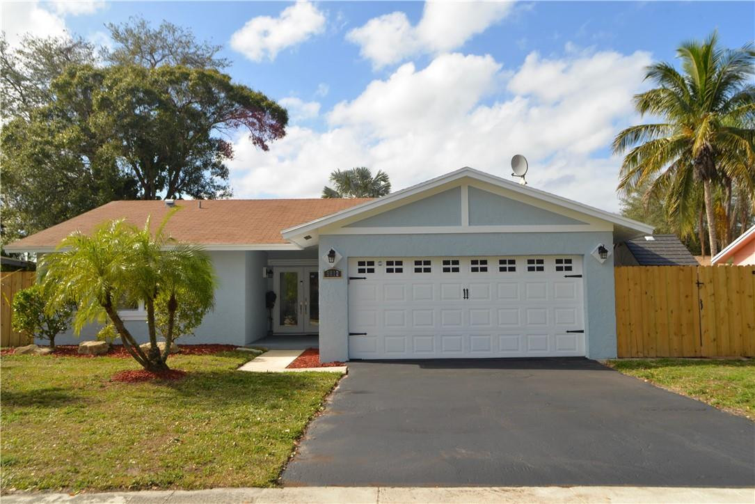 9812 Spanish Isles Drive Boca Raton, FL 33496 - Photo 1 of 44 a view of a house with a yard