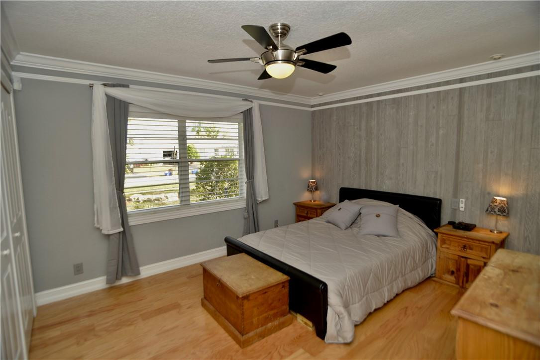 9812 Spanish Isles Drive Boca Raton, FL 33496 - Photo 17 of 44 a bedroom with a bed and window