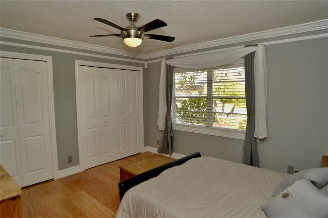 9812 Spanish Isles Drive Boca Raton, FL 33496 - Photo 18 of 44 a bedroom with a large bed and a window