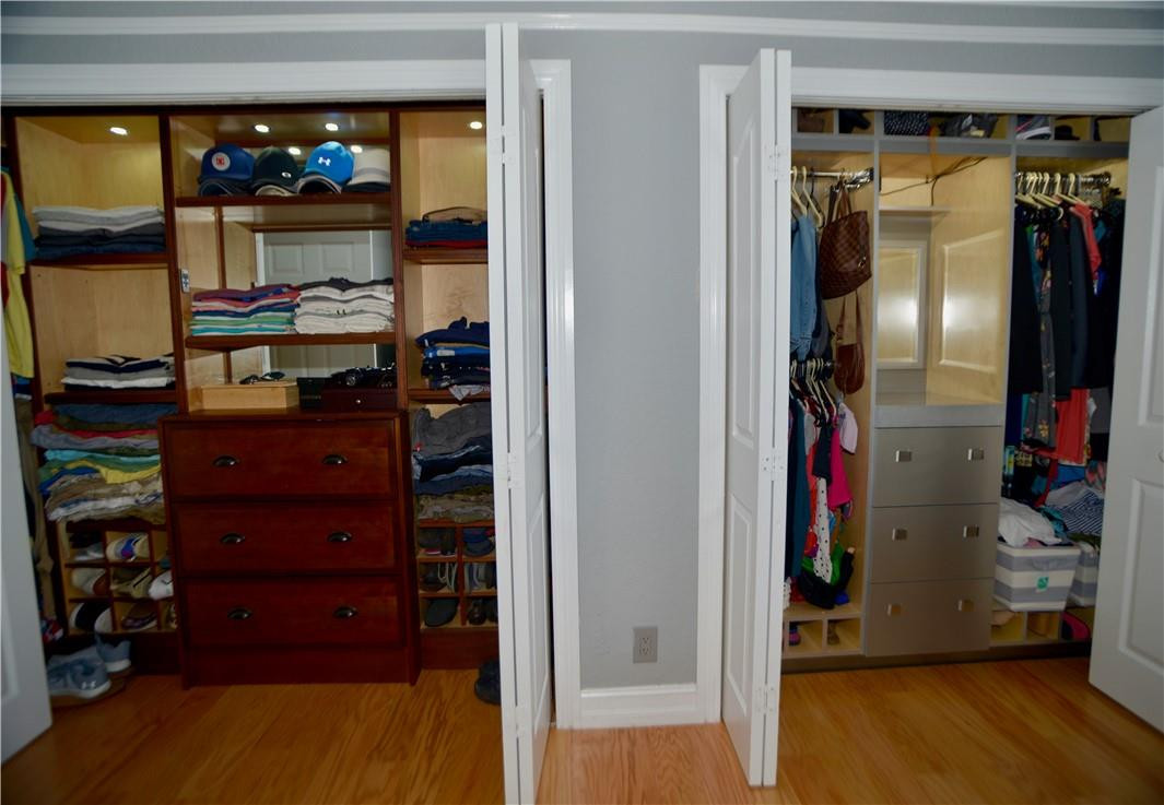 9812 Spanish Isles Drive Boca Raton, FL 33496 - Photo 20 of 44 a view of walk in closet with clothes and shoes