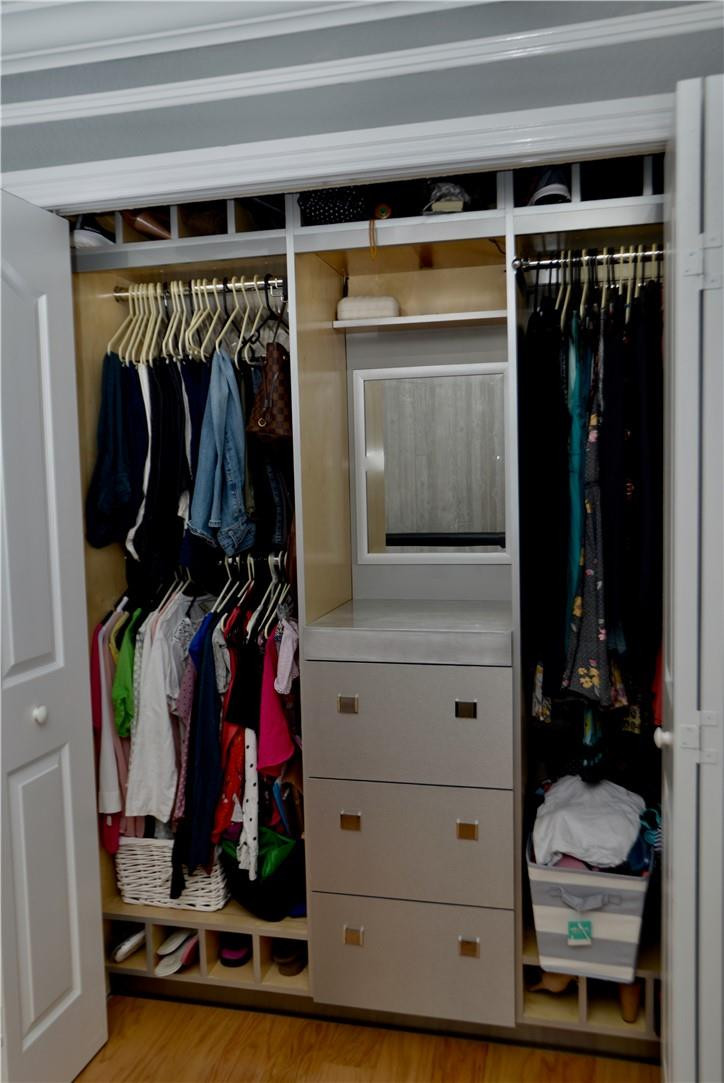 9812 Spanish Isles Drive Boca Raton, FL 33496 - Photo 21 of 44 a view of walk in closet with clothes and shoes