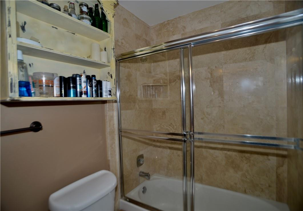 9812 Spanish Isles Drive Boca Raton, FL 33496 - Photo 29 of 44 a bathroom with a shower and a toilet