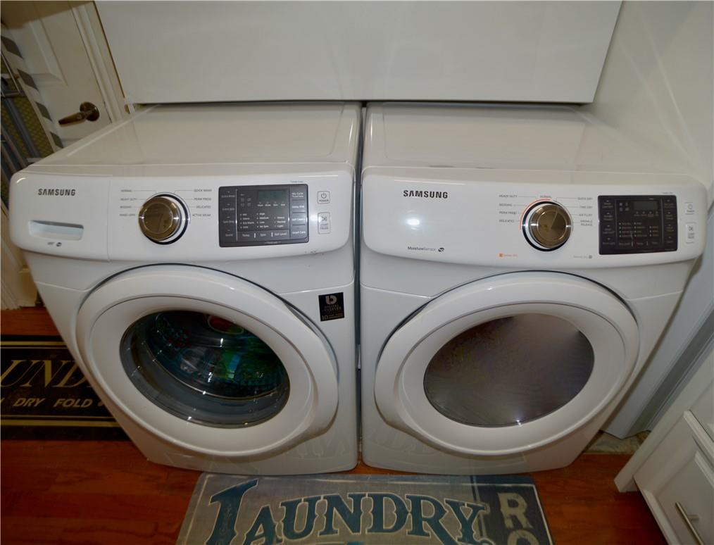 9812 Spanish Isles Drive Boca Raton, FL 33496 - Photo 36 of 44 a utility room with dryer and washer