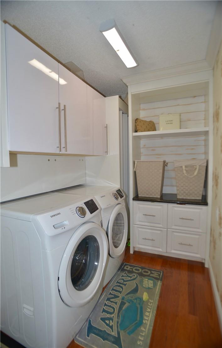9812 Spanish Isles Drive Boca Raton, FL 33496 - Photo 37 of 44 a utility room with dryer and washer
