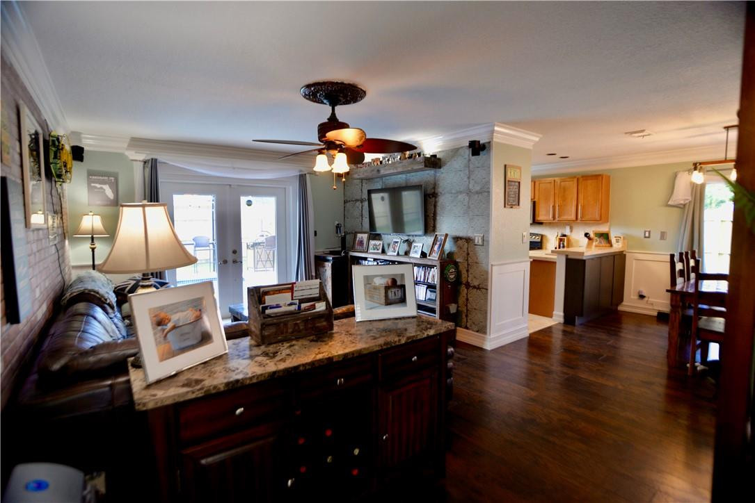 9812 Spanish Isles Drive Boca Raton, FL 33496 - Photo 5 of 44 a kitchen with stainless steel appliances kitchen island granite countertop a stove refrigerator and cabinets