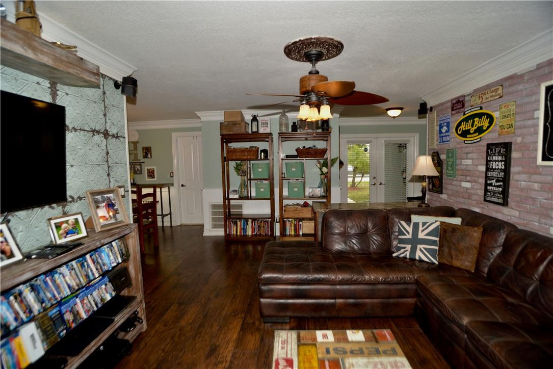 9812 Spanish Isles Drive Boca Raton, FL 33496 - Photo 8 of 44 a living room with furniture and a flat screen tv