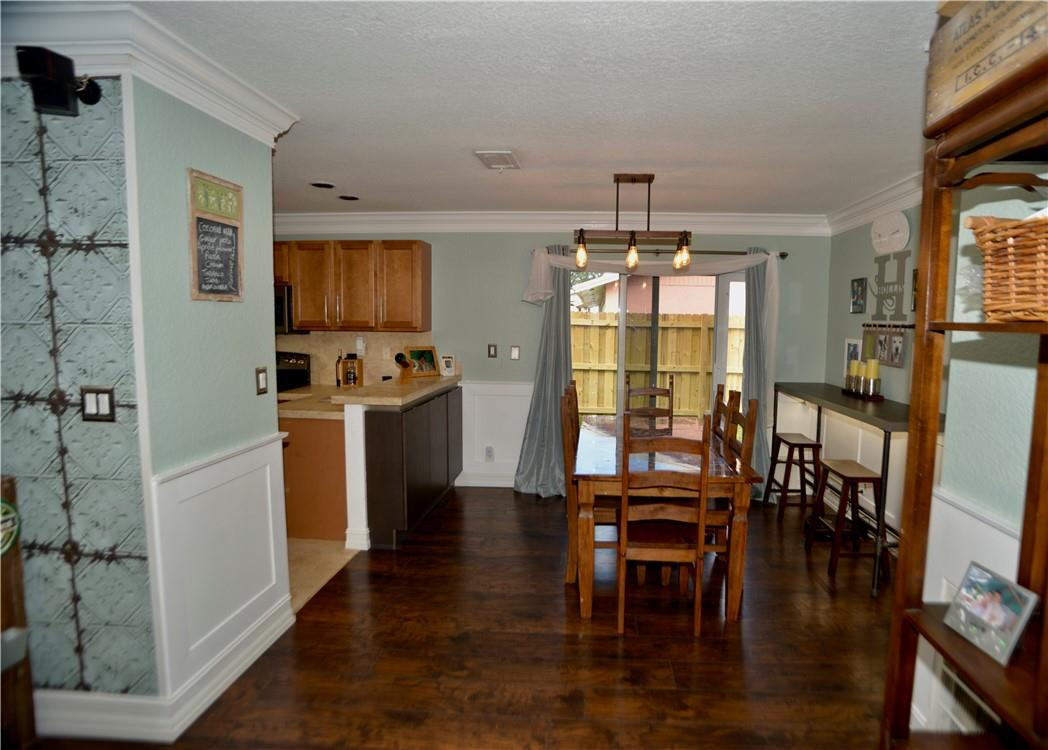 9812 Spanish Isles Drive Boca Raton, FL 33496 - Photo 9 of 44 a view of a dining room with furniture window and wooden floor