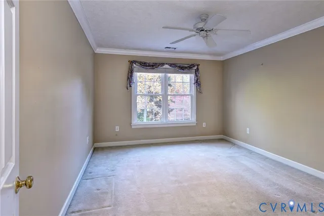 a view of room with window and wooden floor