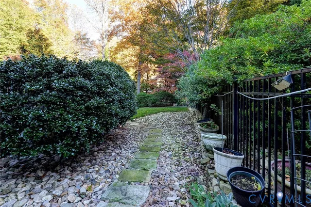 a view of a park with large trees