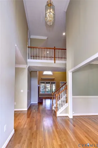 a view of an entryway with wooden floor