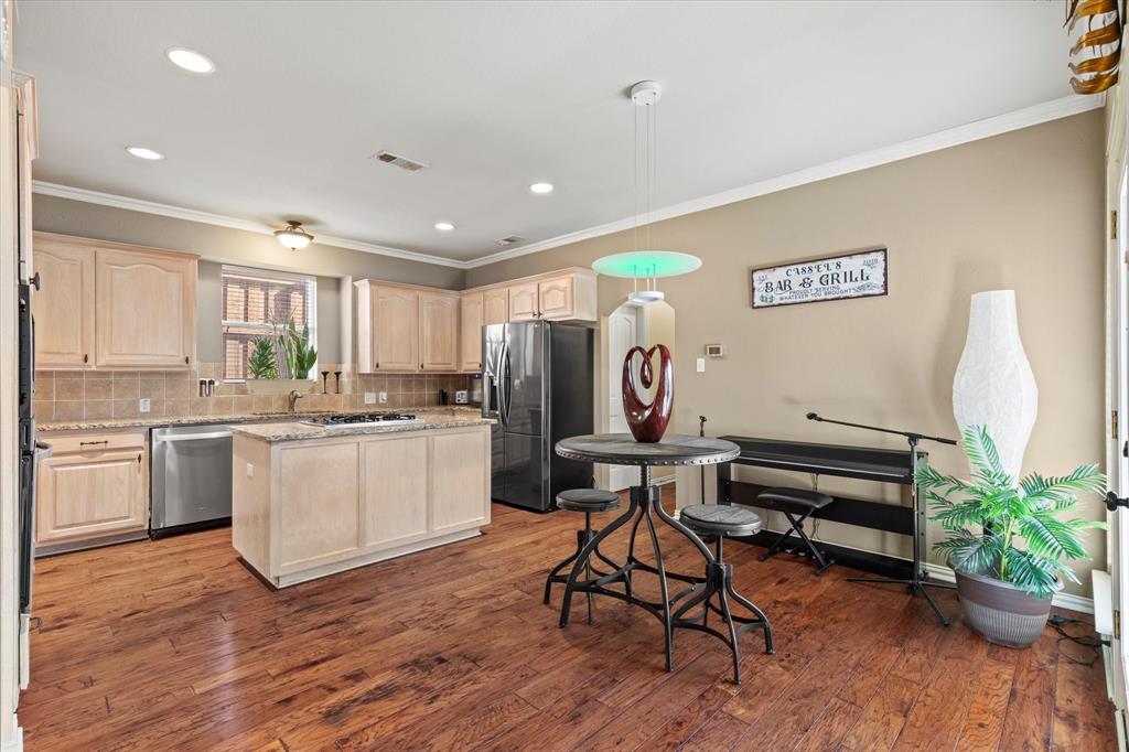 3710 Sam Rayburn Trail Dallas, TX 75287 - Photo 12 of 36 a kitchen with a sink and a stove top oven
