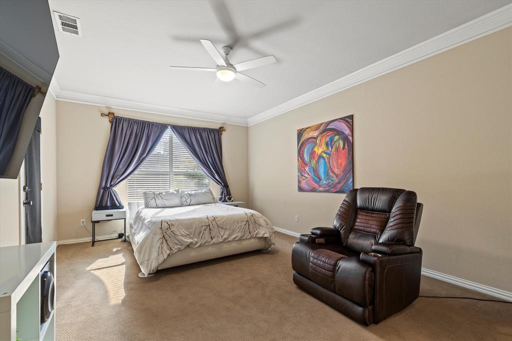 3710 Sam Rayburn Trail Dallas, TX 75287 - Photo 18 of 36 a bedroom with a bed and a couch