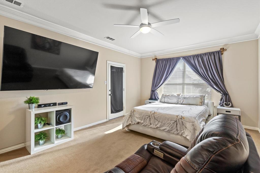 3710 Sam Rayburn Trail Dallas, TX 75287 - Photo 19 of 36 a bedroom with a bed and a flat screen tv