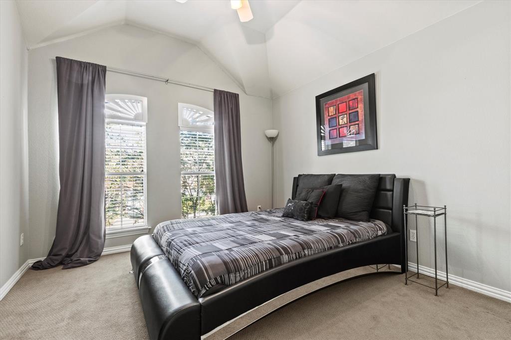 3710 Sam Rayburn Trail Dallas, TX 75287 - Photo 27 of 36 a bedroom with a bed and a night stand