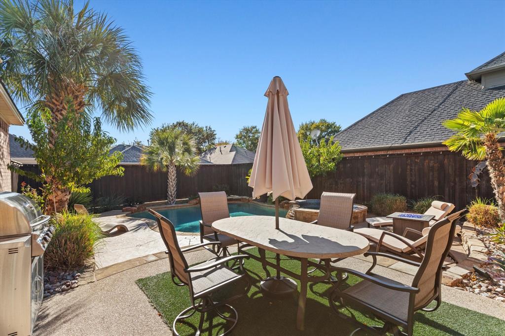 3710 Sam Rayburn Trail Dallas, TX 75287 - Photo 33 of 36 a view of a patio with table and chairs and potted plants