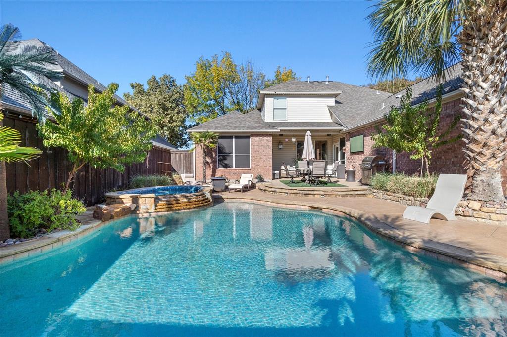 3710 Sam Rayburn Trail Dallas, TX 75287 - Photo 35 of 36 a front view of a house with swimming pool garden and patio