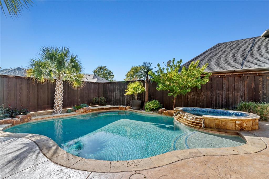 3710 Sam Rayburn Trail Dallas, TX 75287 - Photo 36 of 36 a view of a backyard with table and chairs potted plants and wooden fence