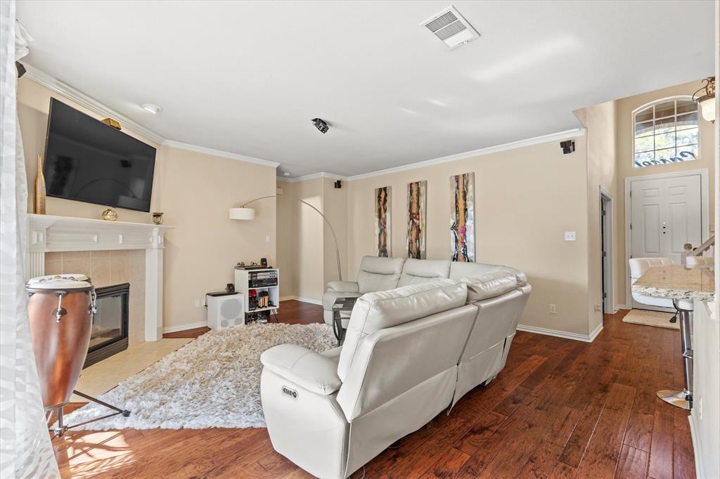 3710 Sam Rayburn Trail Dallas, TX 75287 - Photo 7 of 36 a living room with furniture and a flat screen tv