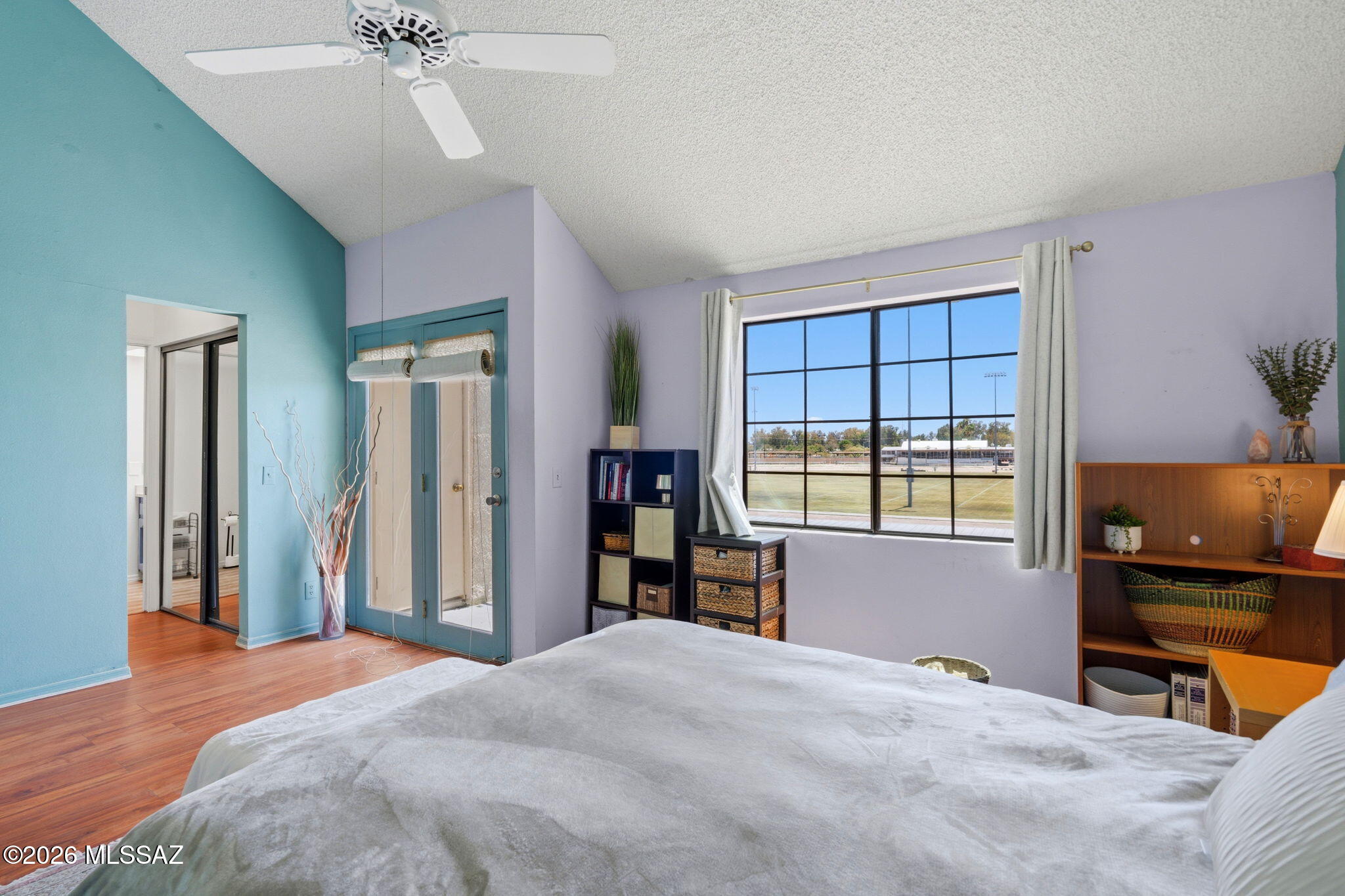 1200 East River Road, Unit G87 Tucson, AZ 85718 - Photo 15 of 30 a bedroom with a bed and a window