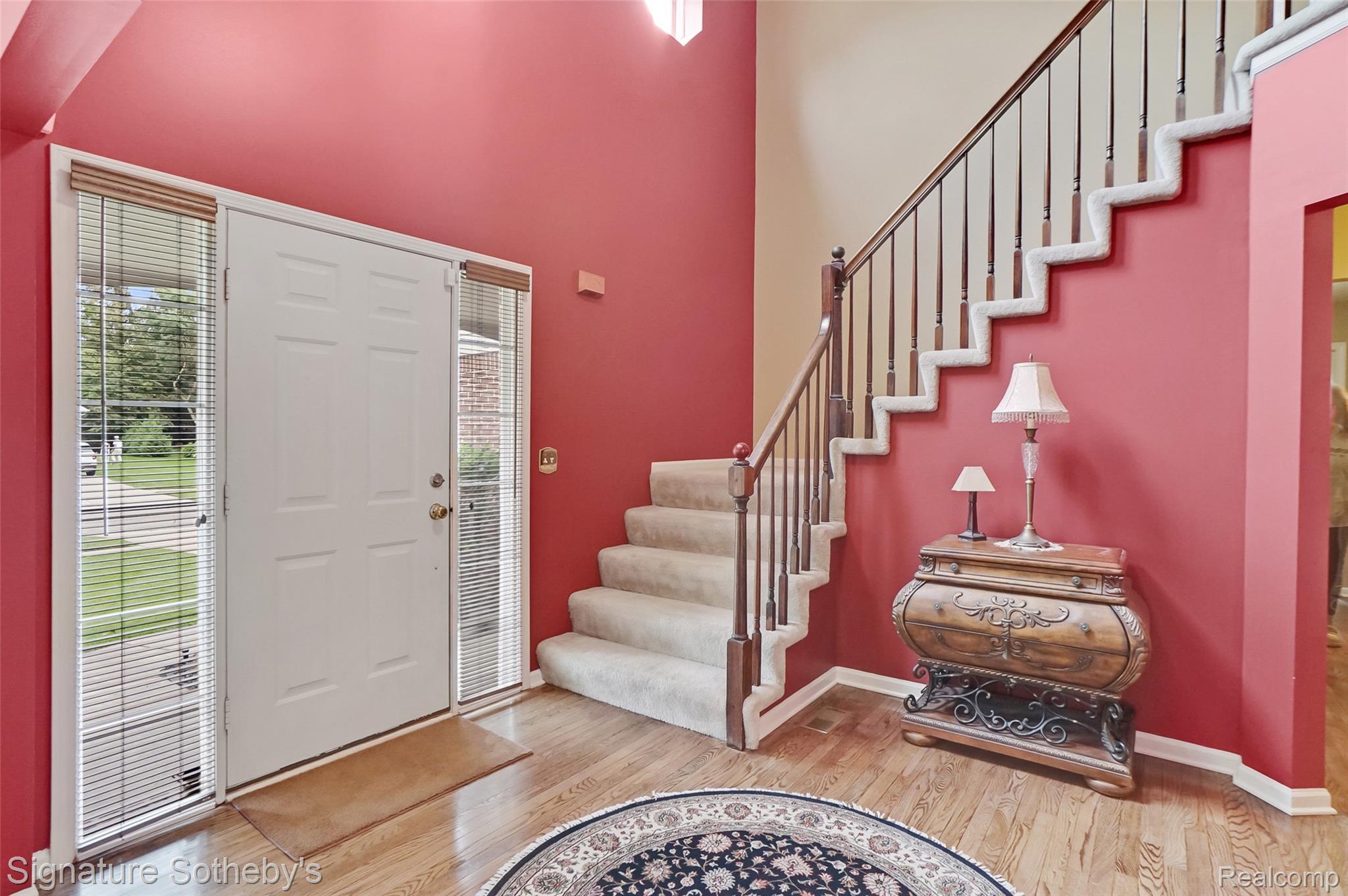 170 Fairhill Way Howell, MI 48843 - Photo 3 of 60 Grand two-story foyer with wood flooring, and entry door with sidelight windows