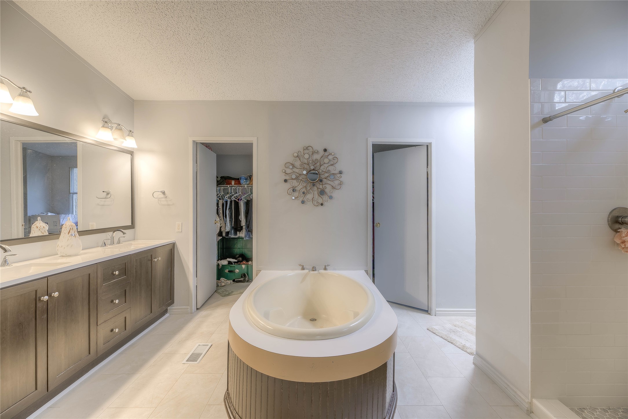 17709 Pine View Drive Conroe, TX 77302 - Photo 21 of 26 a bathroom with a sink and a mirror