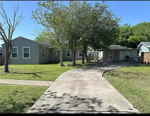 a view of a house with a yard