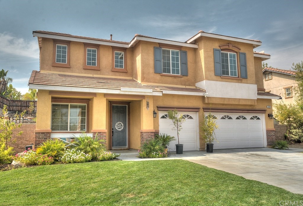 9299 Newbridge Road Riverside, CA 92508 - Photo 1 of 1 front view of a house with a yard