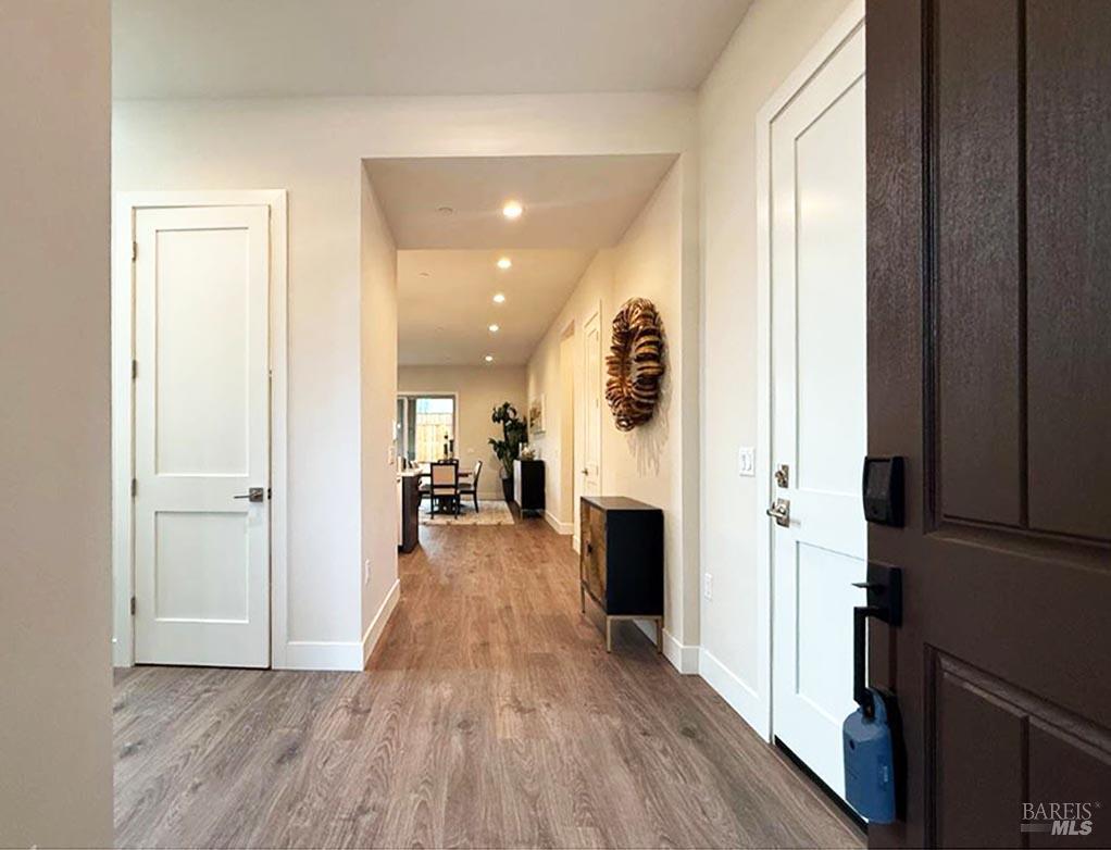 1901 Carlile Place Santa Rosa, CA 95403 - Photo 2 of 29 Welcome to your new home as we enter from the front door. Door to the garage in the right of the photo, door straight ahead is a large coat closet with additional under stairway storage. The office and full bathroom are to the left of this photo.