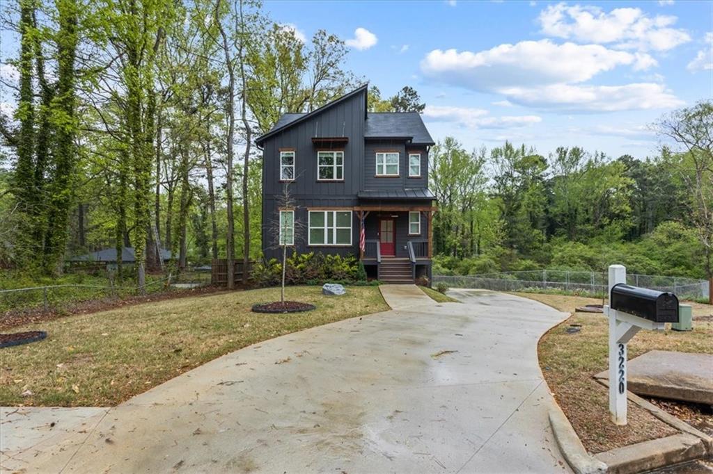 3220 Columbia Oaks Way Decatur, GA 30032 - Photo 1 of 1 a front view of a house with a yard
