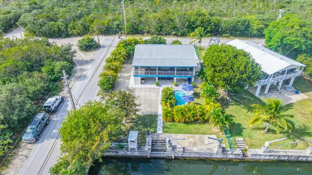 an aerial view of a house with a garden and plants