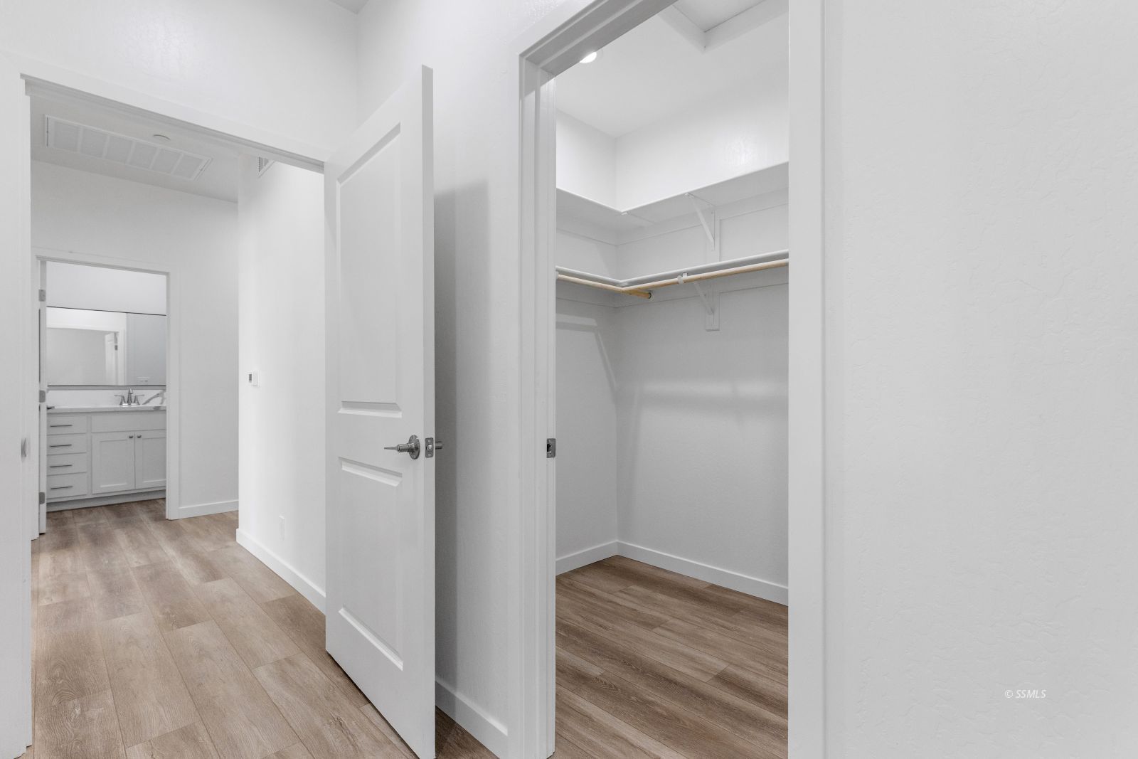 1112 Vulcan Ridgecrest, CA 93555 - Photo 17 of 30 a view of a hallway with wooden floor