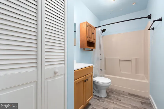 a bathroom with a toilet a sink and a shower