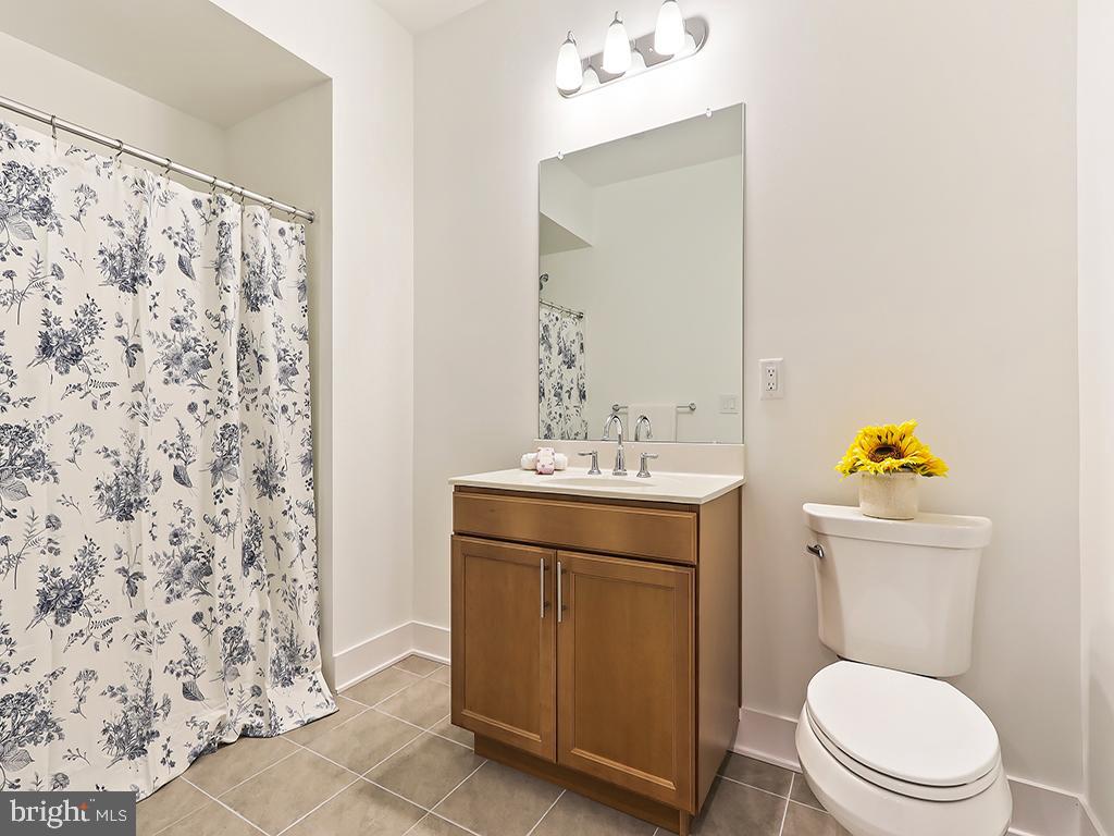6105 Vivaldi Road Princeton, NJ 08540 - Photo 11 of 28 a bathroom with a toilet sink and mirror