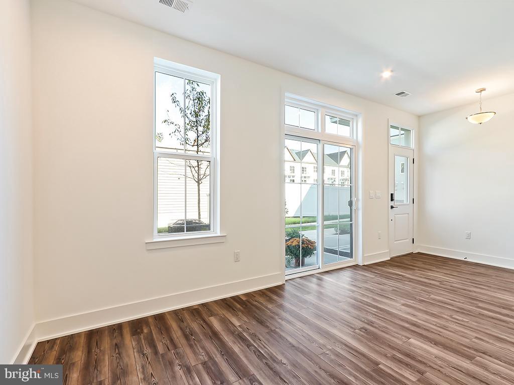 6105 Vivaldi Road Princeton, NJ 08540 - Photo 6 of 28 an empty room with wooden floor and windows