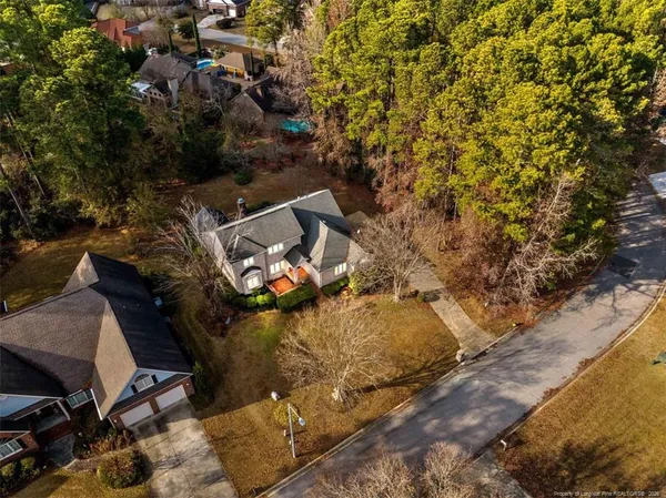a view of a backyard with plants and a patio