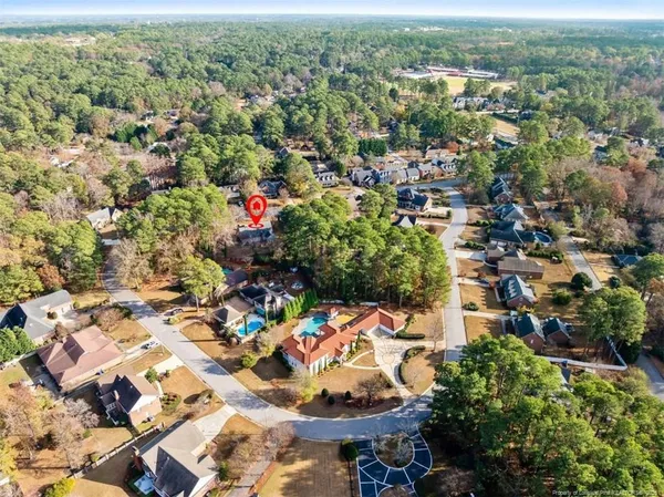 an aerial view of residential houses with outdoor space