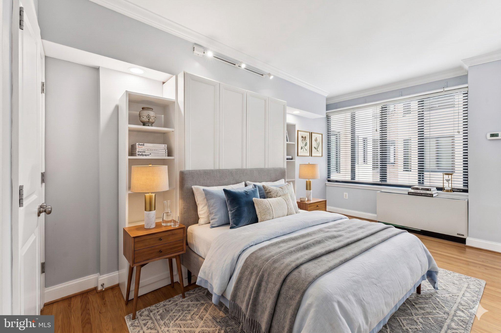 1701 16th Street Northwest, Unit 304 Washington, DC 20009 - Photo 1 of 18 a bedroom with a bed and a window