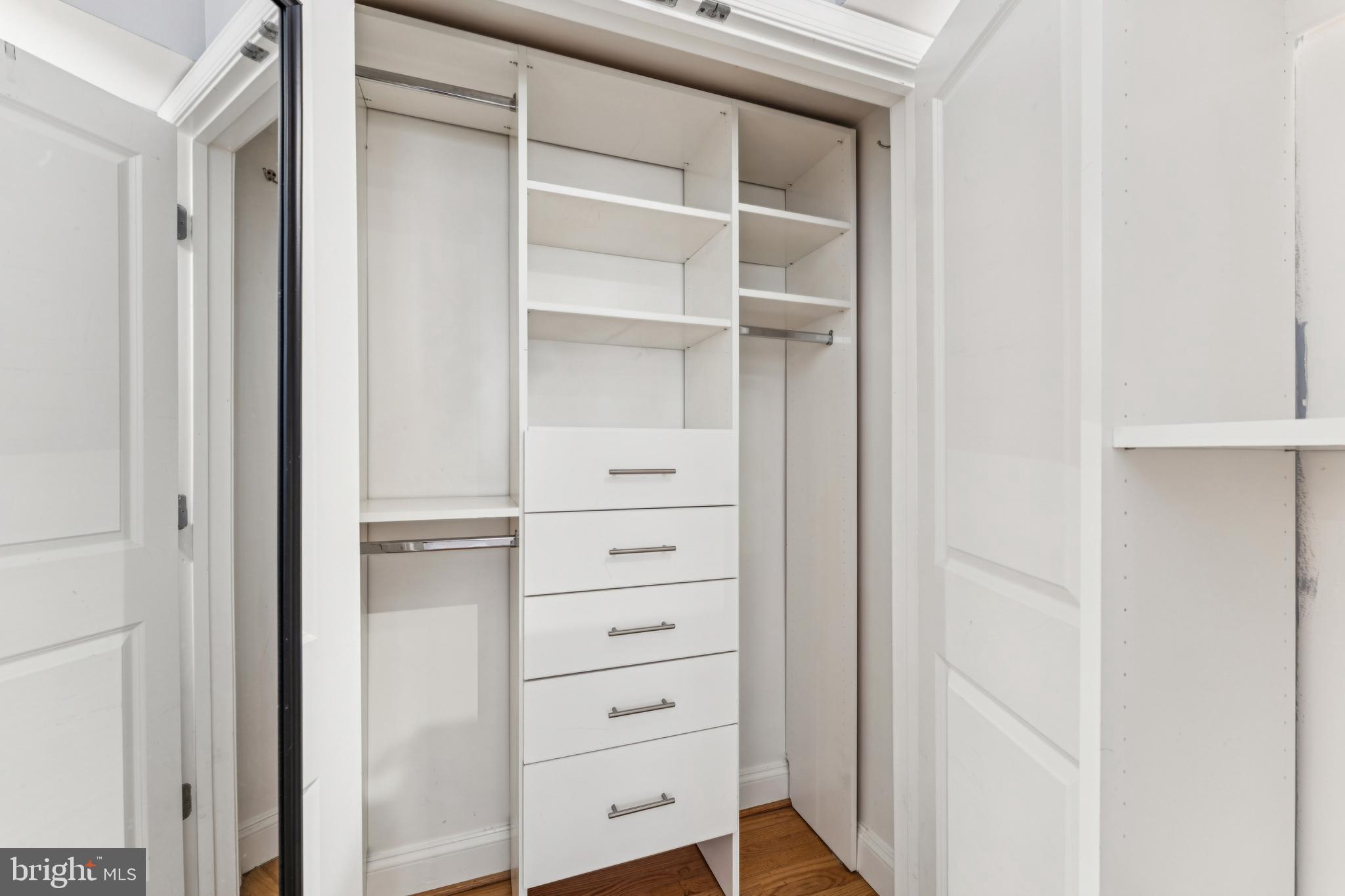 1701 16th Street Northwest, Unit 304 Washington, DC 20009 - Photo 12 of 18 a view of walk in closet with empty racks