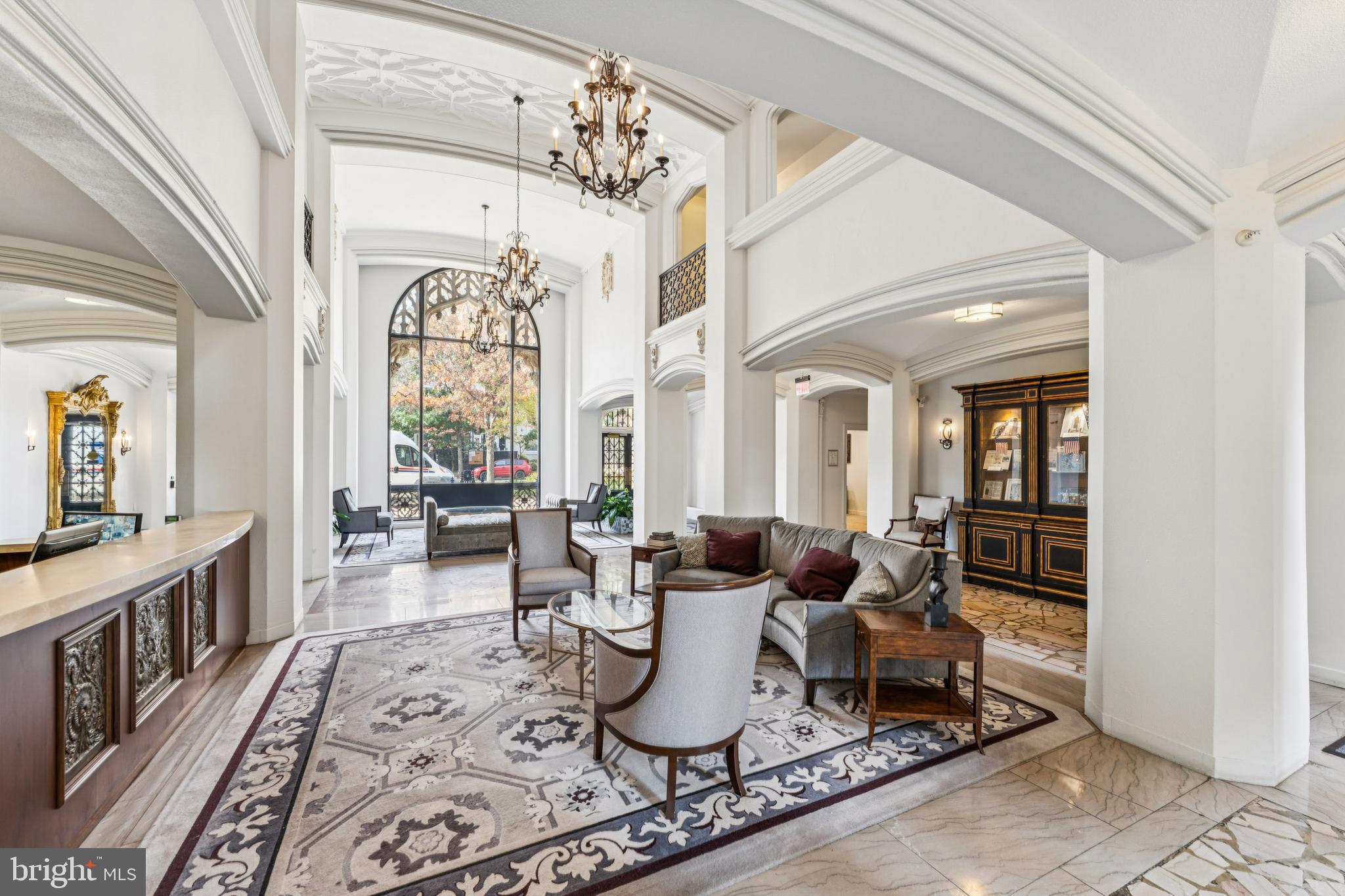 1701 16th Street Northwest, Unit 304 Washington, DC 20009 - Photo 12 of 15 a living room with furniture large window and wooden floor