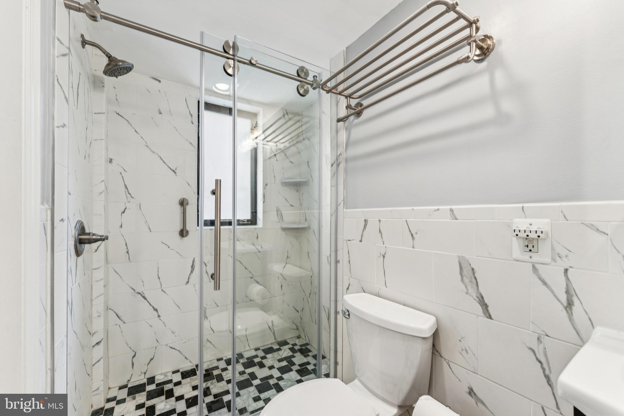 1701 16th Street Northwest, Unit 304 Washington, DC 20009 - Photo 13 of 18 a bathroom with a shower and a toilet